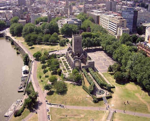 Looking across Castle Park in central Bristol. The ruined church, St. Peters, was gutted by enemy action in 1940.
The channeled River Avon (called the Floating Harbour) is on the left.