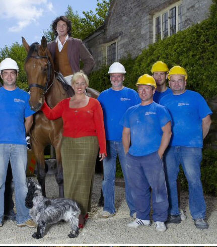 Lawrence Llewelyn-Bowen and wife Jackie with builders outside Roberts House at Siddington near Cirencester