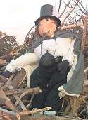 Guy Fawke effigy on top of bonfire waiting to be burnt at night fall